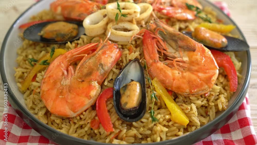 Seafood Paella with prawns, clams, mussels on saffron rice - Spanish food style Seafood Paella with prawns, clams, mussels on saffron rice - Spanish food style