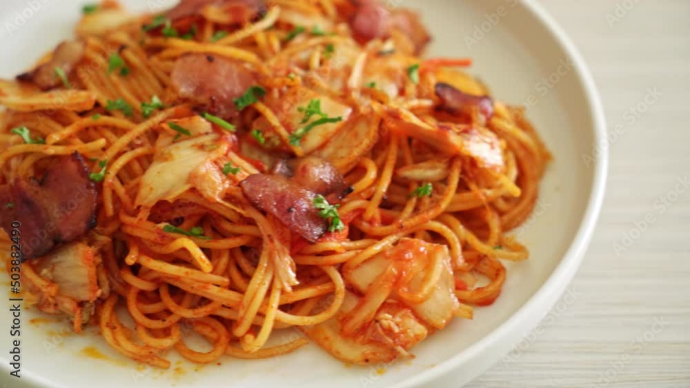 stir-fried spaghetti with kimchi and bacon - fusion food style stir-fried spaghetti with kimchi and bacon - fusion food style