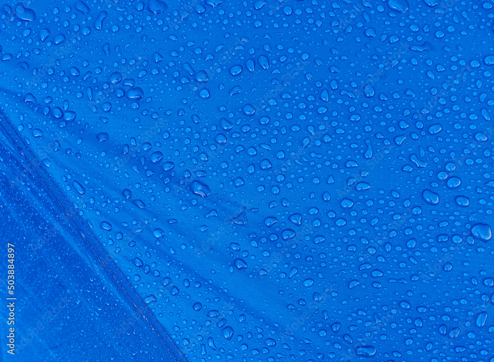 Obraz premium Water drops on waterproof membrane fabric. Morning dew on tent.