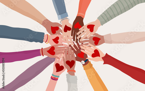 Palms up of group of diverse people in circle with heart in hand. Charity donation and volunteer work. Support and assistance. Multicultural and multiethnic community. People diversity