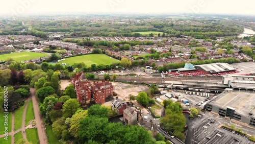 Reverse aerial shot of a train leaving Preston train station photo