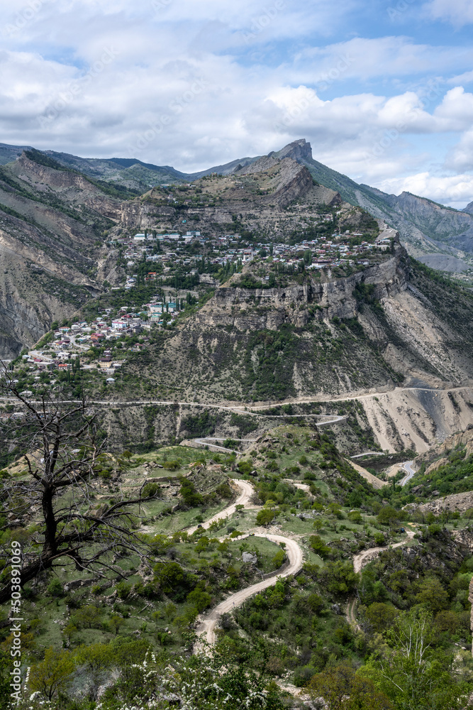 panoramic view of the alpine settlements in the mountains of Dagestan against the backdrop of mountains and the sky panoramic view of the alpine settlements in the mountains of Dagestan against the backdrop of mountains and the sky