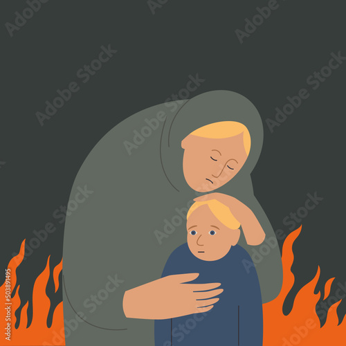 Mother hugging her child . The refugees fleeing the war	and fire 
