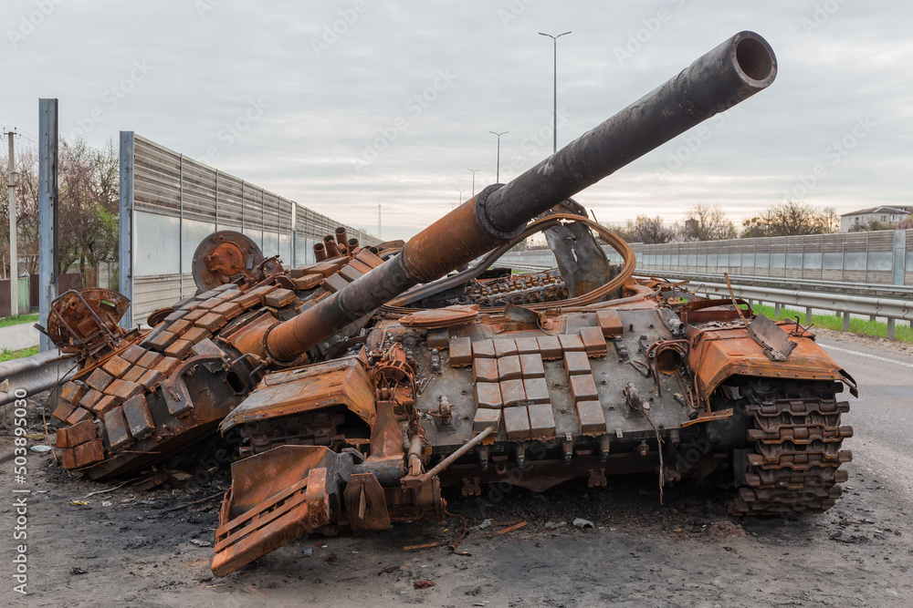 Destroyed russian tank on highway in invasion of Ukraine Destroyed russian tank on highway in invasion of Ukraine