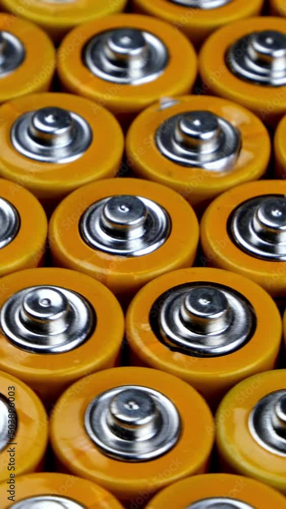 Many used AA alkaline batteries, finger batteries ready for recycling