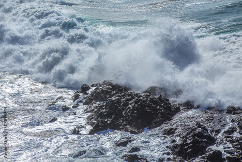 Fototapeta Naklejka Na Ścianę i Meble -  Big waves break against the rocks on a rough sea day