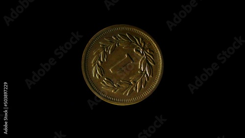 Rotating reverse of Switzerland coin 1 rappen minted from 1850 till 1941. Isolated in black background. photo