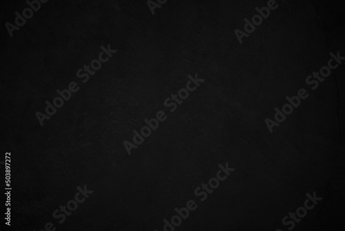 Black concrete stone texture for background in black. Cement and sand grey dark detail covering.