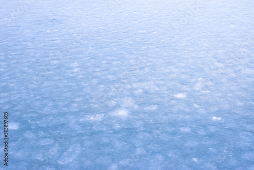 Natural texture of ice  frozen lake  as  background.