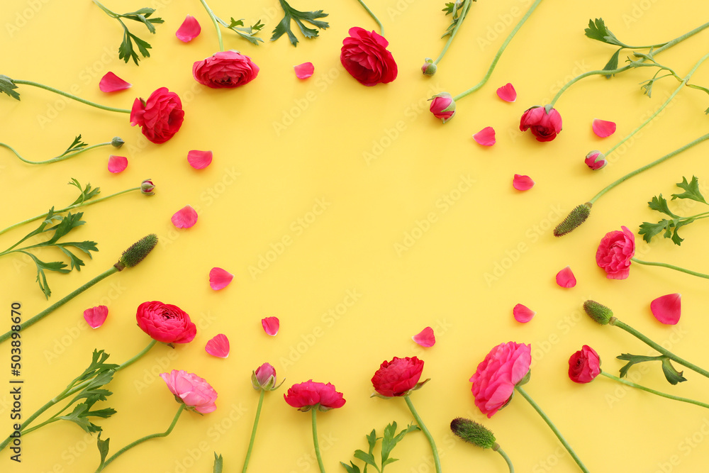 Top view image of pink flowers composition over yellow background Top view image of pink flowers composition over yellow background