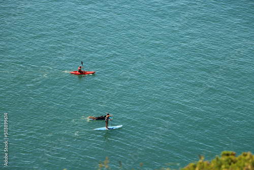 Paddle boarding in the azure English seas just off the North Devon coast