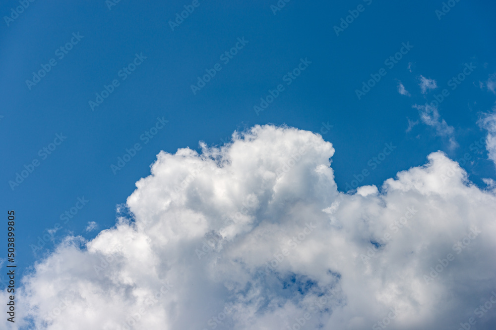 Beautiful storm clouds, cumulus clouds or cumulonimbus against a clear blue sky. Photography, full frame, sky only. Beautiful storm clouds, cumulus clouds or cumulonimbus against a clear blue sky. Photography, full frame, sky only.