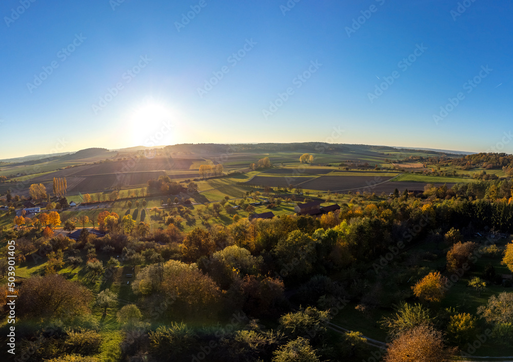 Aerial shot of scenic autumn landscape at sunset in Southern Germany