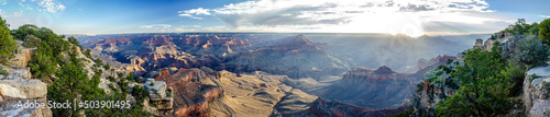 Ultra-widescreen panorama shot of the Grand Canyon at sunrise