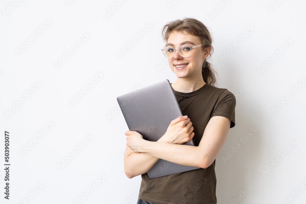 Portrait of a businesswoman carrying laptop isolated over white background Portrait of a businesswoman carrying laptop isolated over white background