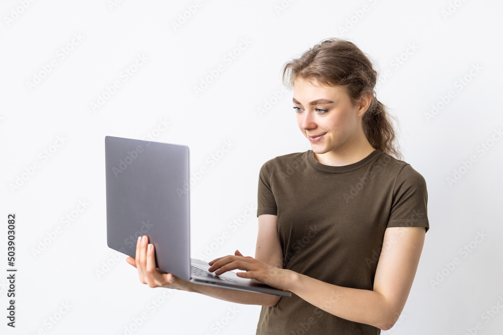 Portrait of happy woman working on laptop computer over white background Portrait of happy woman working on laptop computer over white background