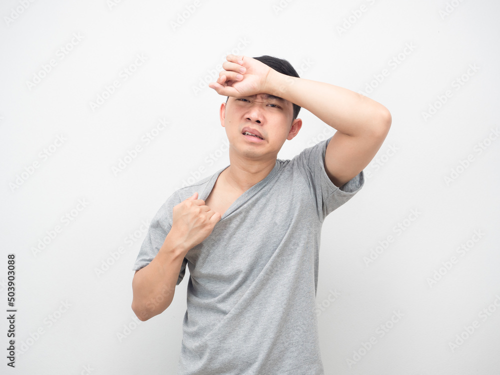Asian man feeling weather it hot gesture heat stroke Asian man feeling weather it hot gesture heat stroke