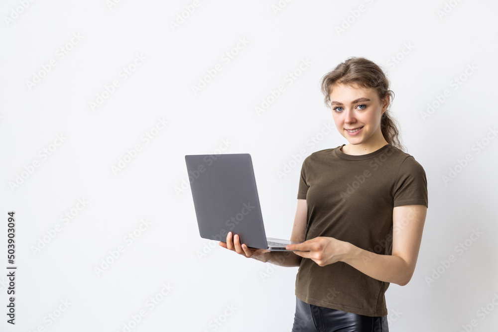 Portrait of happy woman working on laptop computer over white background Portrait of happy woman working on laptop computer over white background