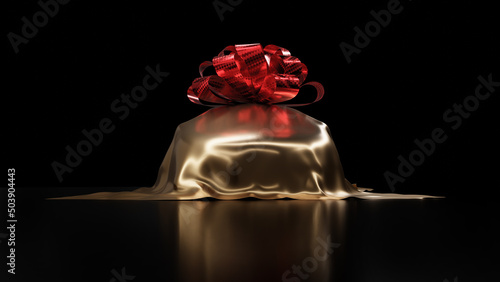 фотографія Front view of luxury car prize, gold silk cloth car cover isolated on black background