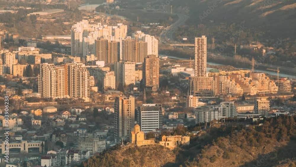 Tbilisi Georgia. Residential Quarters time lapse timelapse. time lapse timelapse elevated view Cityscape Famous Landmark Tabor Monastery In spring Evening sunset . Tbilisi Georgia. Residential Quarters time lapse timelapse. time lapse timelapse elevated view Cityscape Famous Landmark Tabor Monastery In spring Evening sunset .