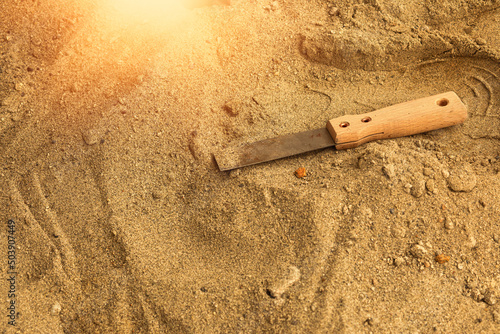 Skeleton and archaeological tools in the sand.Digging for fossils.