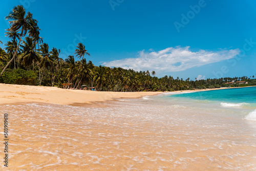 Tropical beautiful landscape, turquoise ocean and bright sand beach, paradise vacation on island.