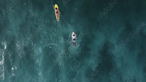 Aerial view of the ocean and surfer girl. Surfing in Midigama. Sri Lanka