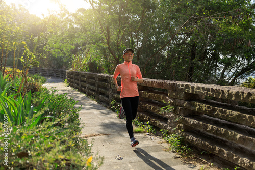 Young asian woman jogging in park © lzf