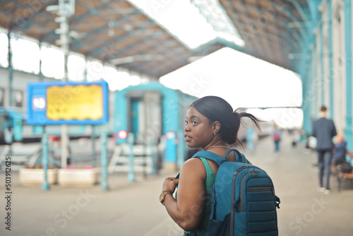 portrait of young woman in a train station