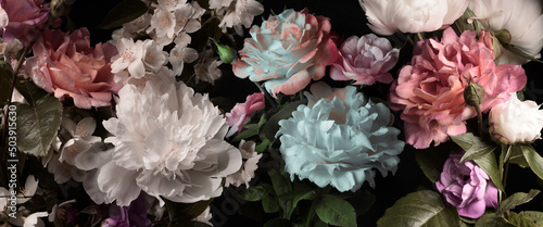 Peonies and roses on a black background, vintage wallpaper, studio shot.
