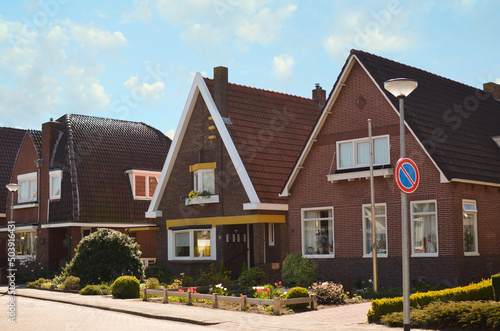 Block of houses on sunny day. Suburban district