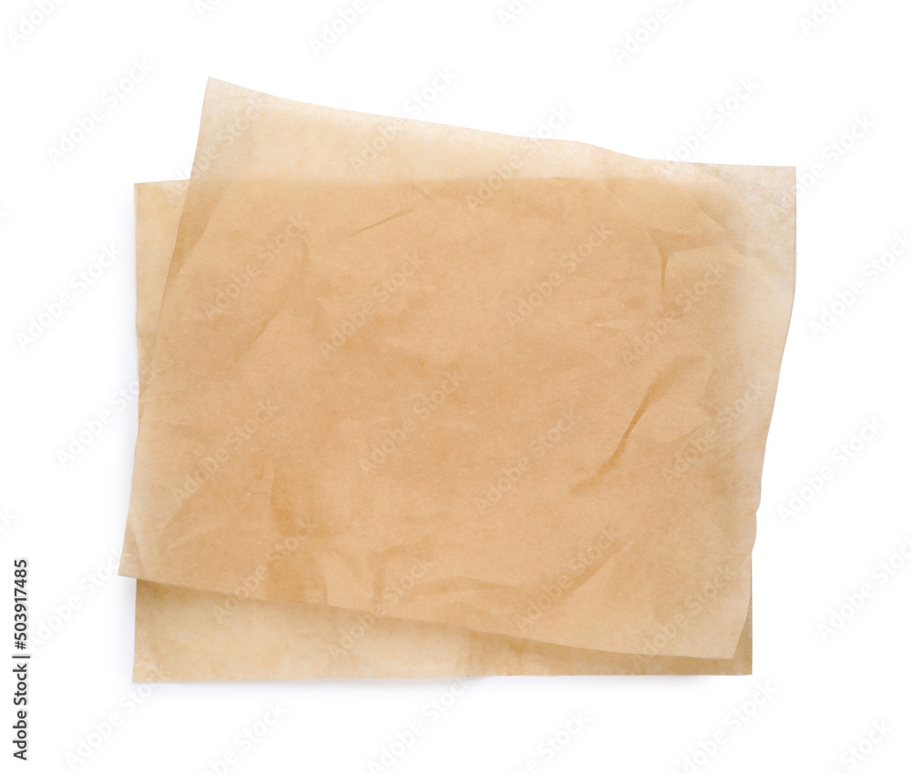 Sheets of brown baking paper on white background, top view