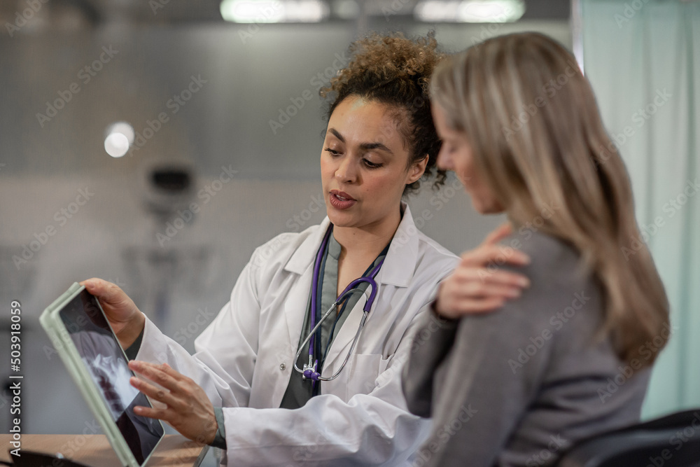 Female Medical Doctor giving patient results Female Medical Doctor giving patient results