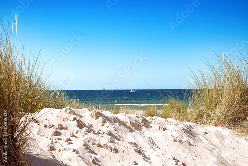 A view through the sand dunes on the beach to the Baltic Sea.