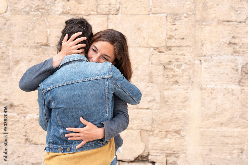 hispanic lesbian couple in an embrace, gay concept hispanic lesbian couple in an embrace, gay concept