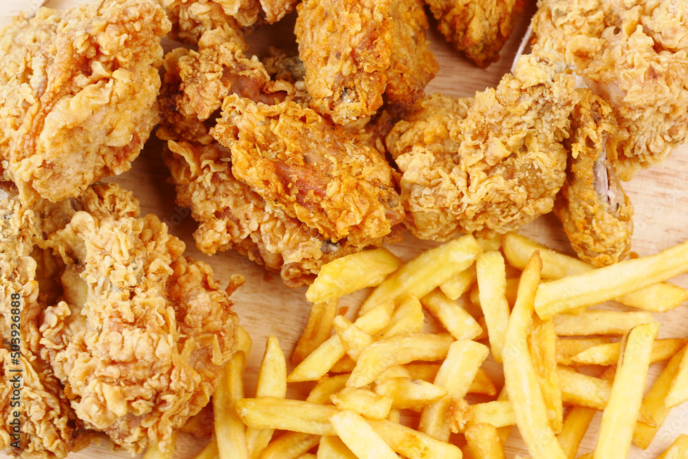 junk foods on plate on wooden table close up junk foods on plate on wooden table close up