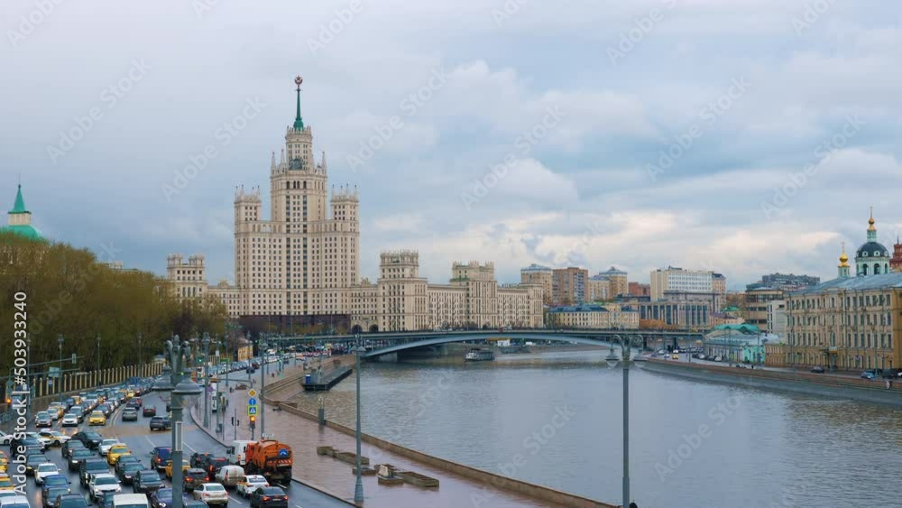 Moscow cityscape with river, bridge, ship, buildings, church, houses, trees, road. Capital of Russia panoramic view. Cloudy day. Urban transport traffic. Automobiles moving on highway Moscow cityscape with river, bridge, ship, buildings, church, houses, trees, road. Capital of Russia panoramic view. Cloudy day. Urban transport traffic. Automobiles moving on highway