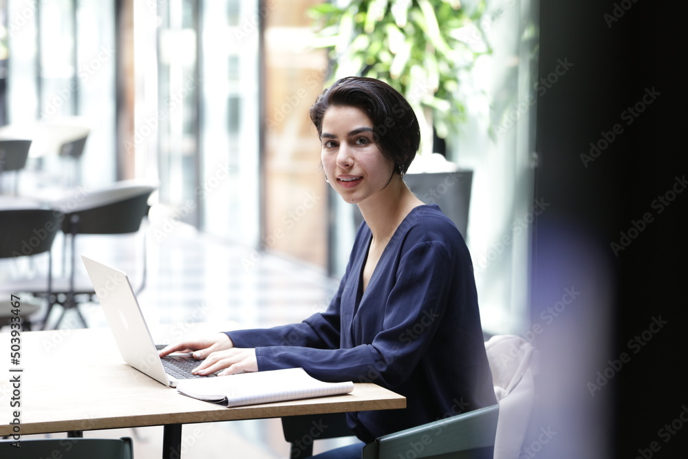 Portrait of businesswoman using laptop in office Portrait of businesswoman using laptop in office
