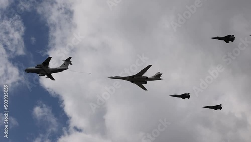 a group of military aircraft flies over Moscow during the rehearsal of the victory parade.