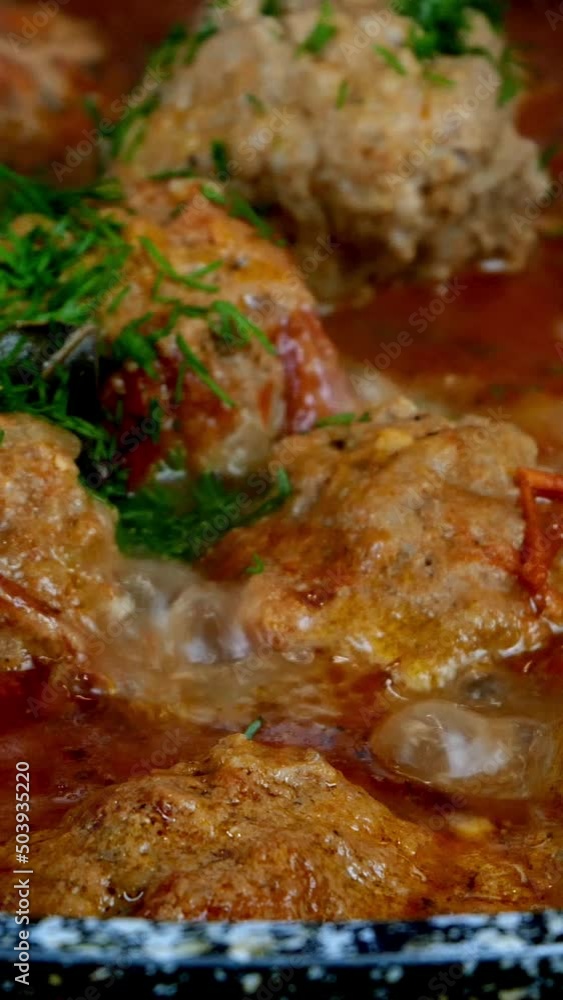 Cooking delicious meatballs in creamy tomato sauce in frying pan. Small round cutlets. Cooking delicious meatballs in creamy tomato sauce in frying pan. Small round cutlets.