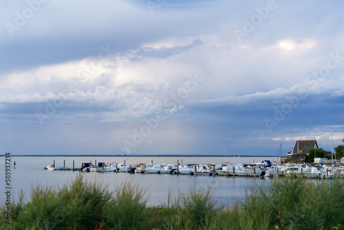 Beautiful and peaceful evening over the small sea harbour with blue clouds and coast line