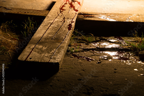 Photo Blood drips on a wooden cross