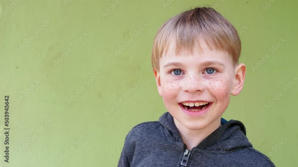 close-up portrait of a blond boy close-up portrait of a blond boy