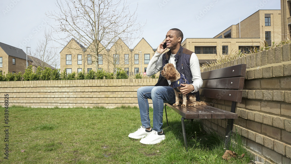 Man with dog sitting on park bench Man with dog sitting on park bench