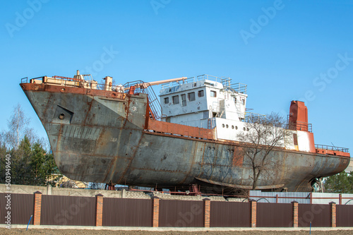 A rusty ship. An open-air dock. Shipbuilding plant. Amur region. Blagoveshchensk