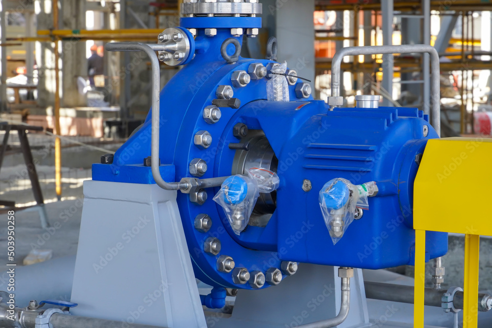 An industrial pump for pumping oil and gas stands on a foundation at a production site in Russia An industrial pump for pumping oil and gas stands on a foundation at a production site in Russia