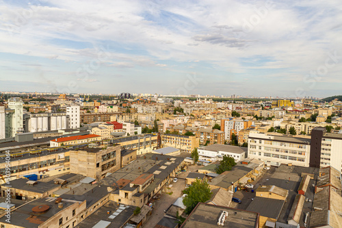 Kyiv, Ukraine – July 08, 2017: A beautiful panorama of Podil area. Aerial view on residential and industrial areas. A lot of buildings of different architectural style. Historical area, Dnipro river.