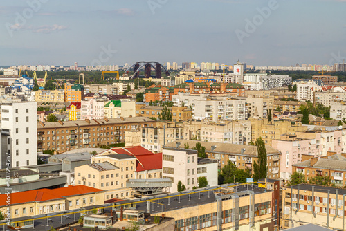 Fototapeta Naklejka Na Ścianę i Meble -  Kyiv, Ukraine – July 08, 2017: A beautiful panorama of Podil area. Aerial view on residential and industrial areas. A lot of buildings of different architectural style. Historical area, Dnipro river.