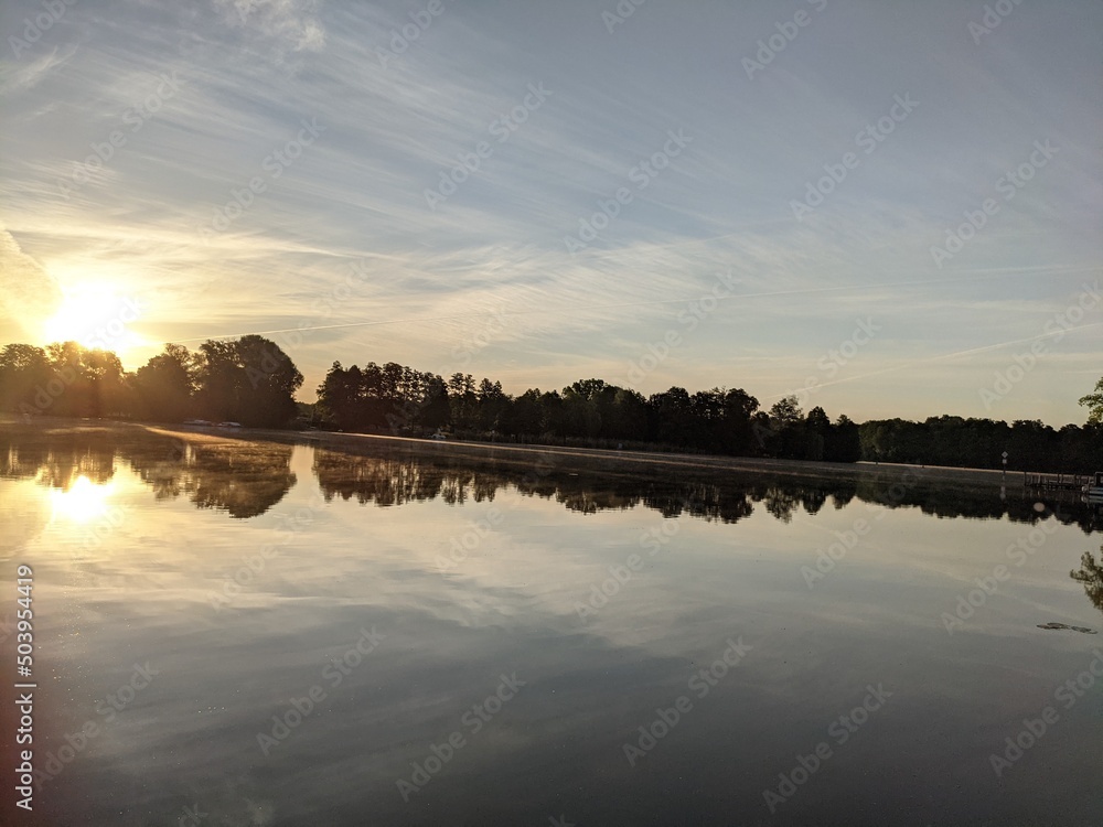 Obraz premium sunset over the river