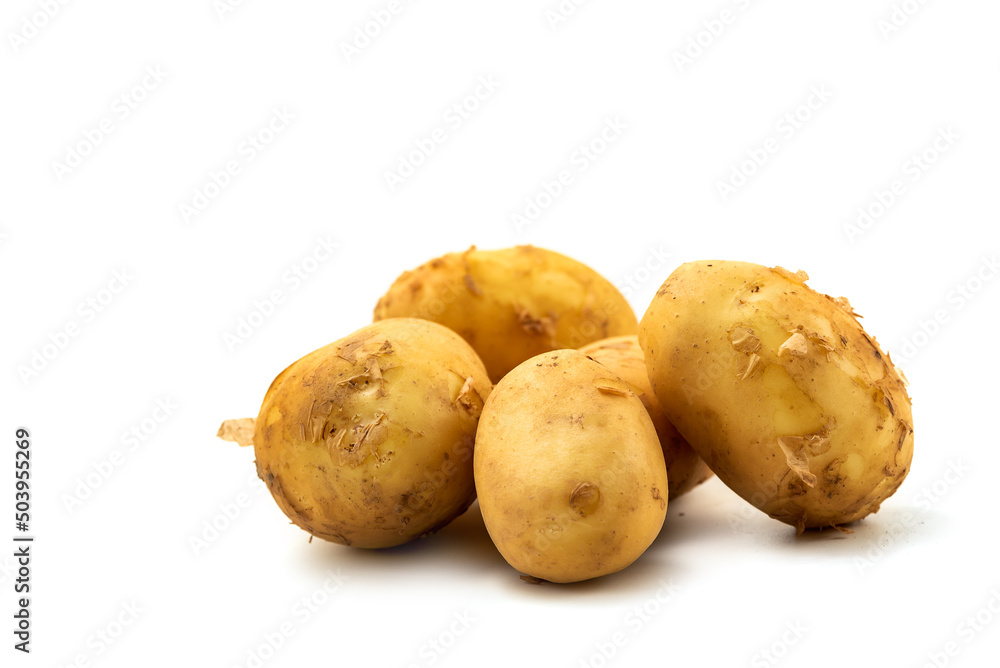 Heap of young potato isolated on white background with clipping path included. Organic potato right from the garden Heap of young potato isolated on white background with clipping path included. Organic potato right from the garden